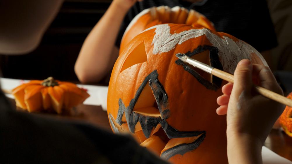 Carving and painting pumpkin 