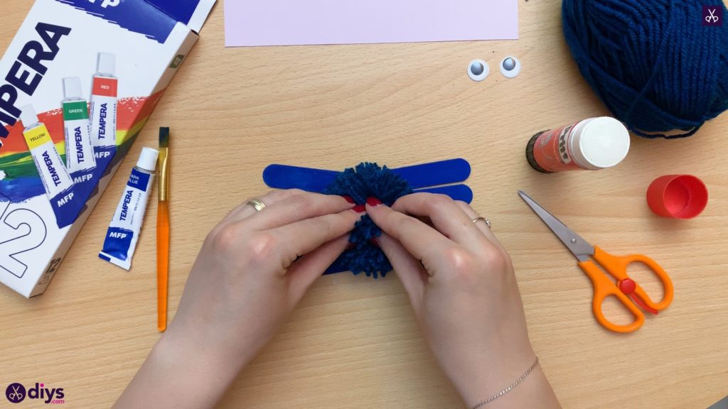 Popsicle stick monster for halloween start with pompom attach