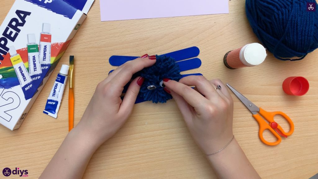 Popsicle stick monster for halloween start with pompom eye