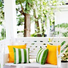 Classic white wooden porch swing
