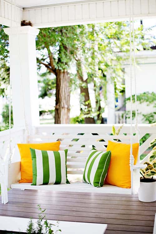 Classic white wooden porch swing