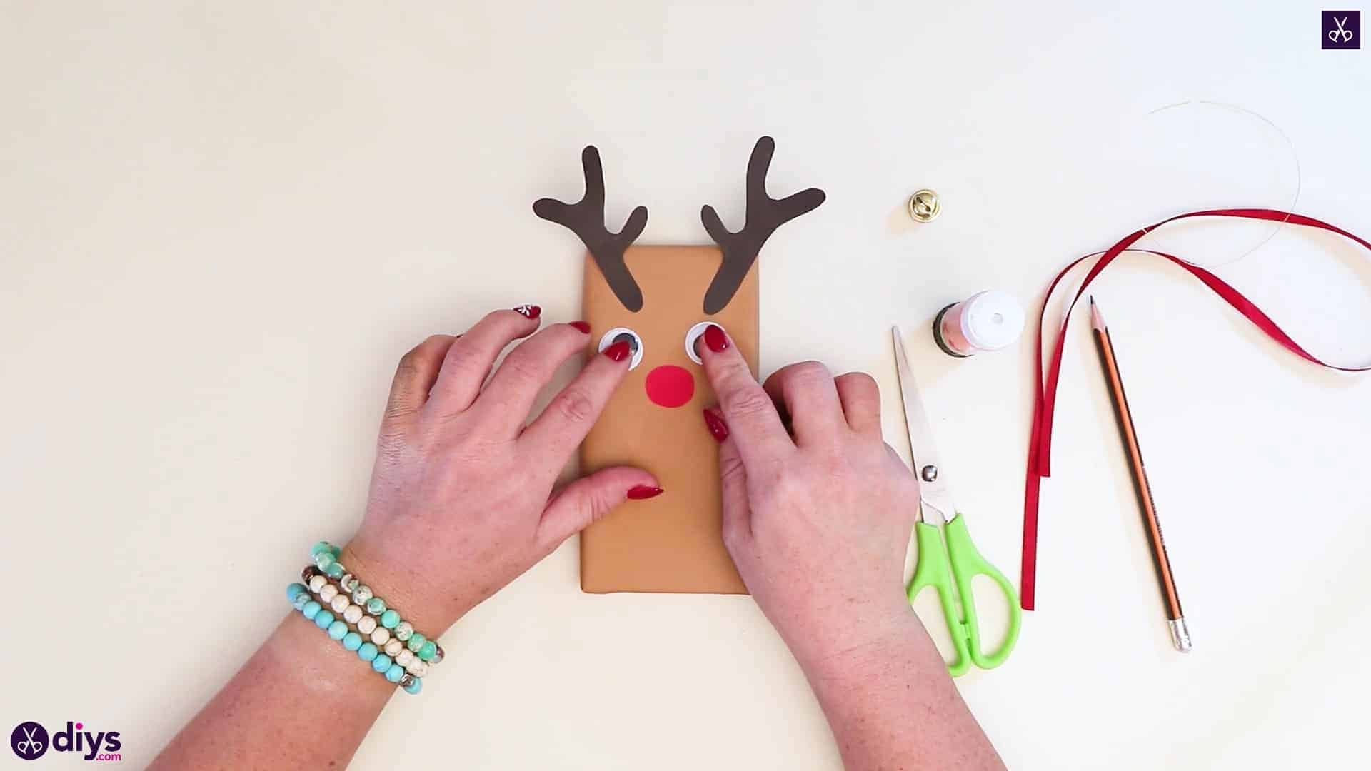 Diy reindeer gift wrap for christmas apply eyes