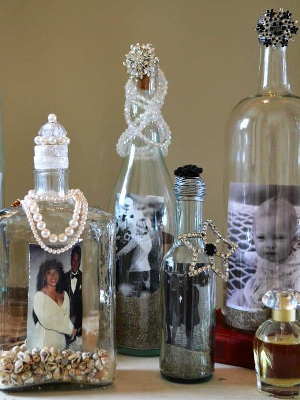 Old jewelry embellished wine bottle photo display