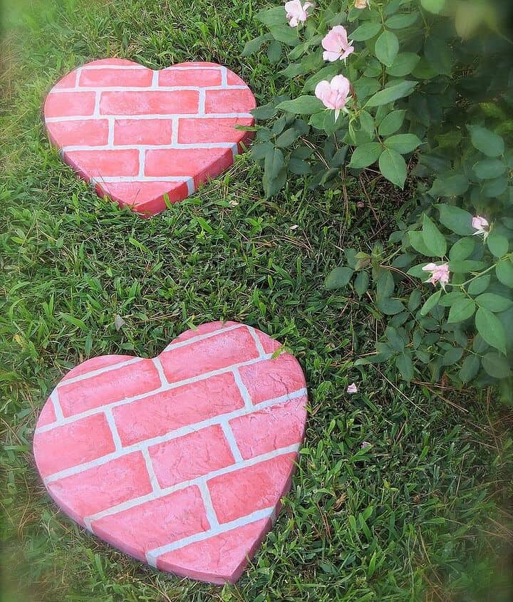 Pink brick painted concrete heart stepping stonesa