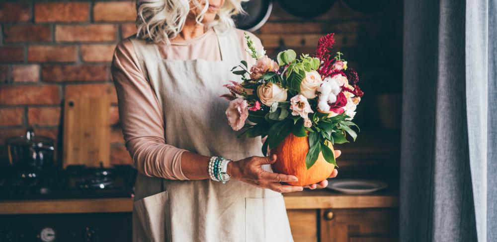 Thanksgiving floral centerpieces flowers in a pumpkin pot