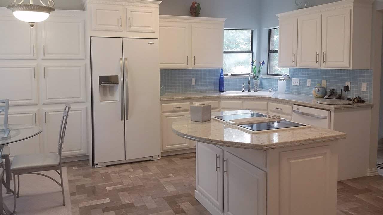 White painted cabinets using old fashioned white washing techniques