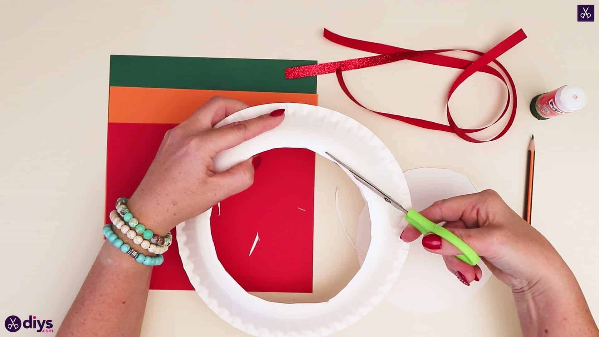 Paper plate wreath with a candle cutting round