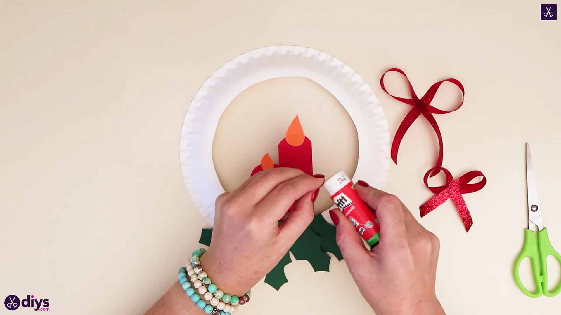 Paper plate wreath with a candle more glue