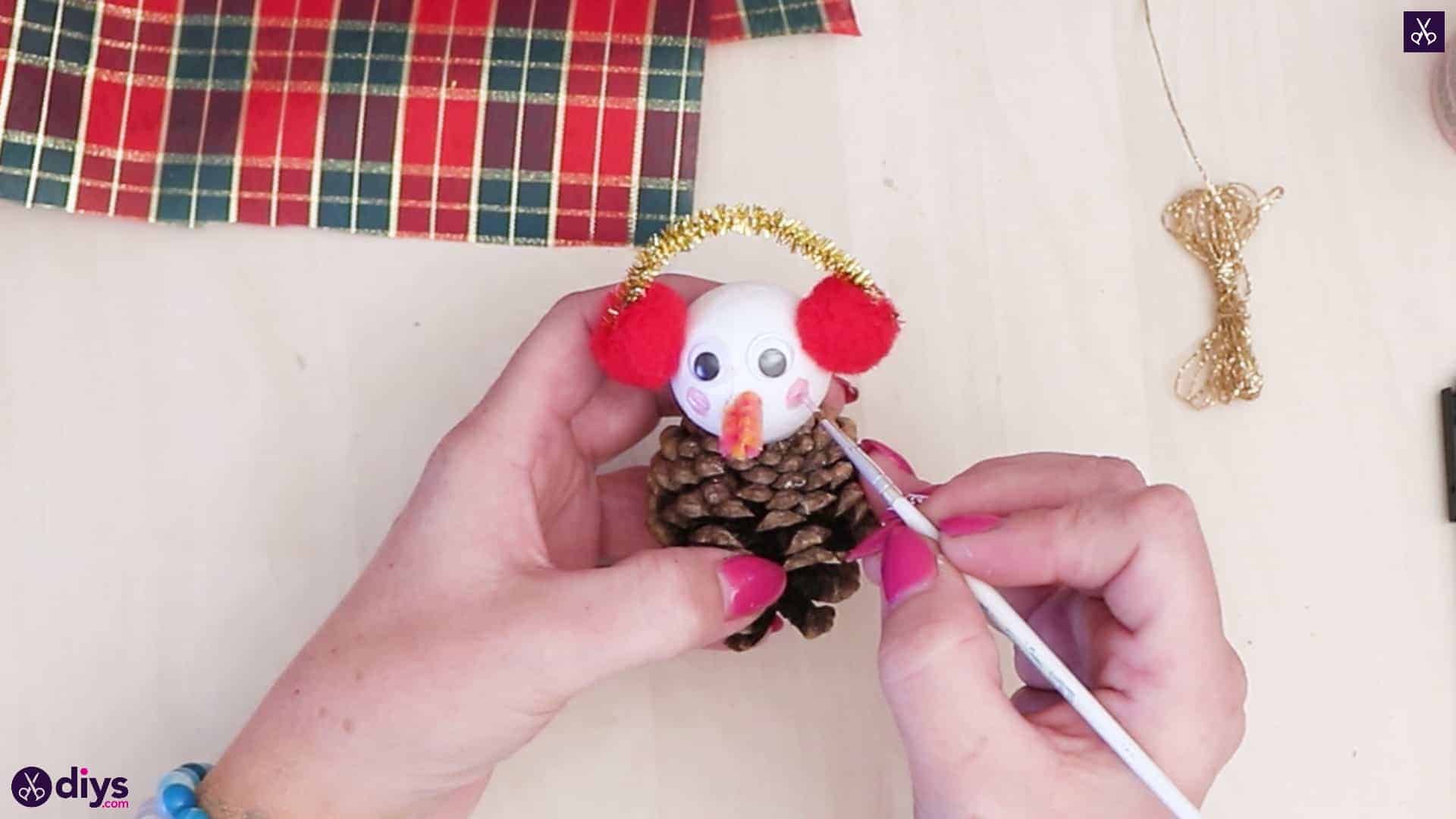 Pinecone snowman with headphones brush