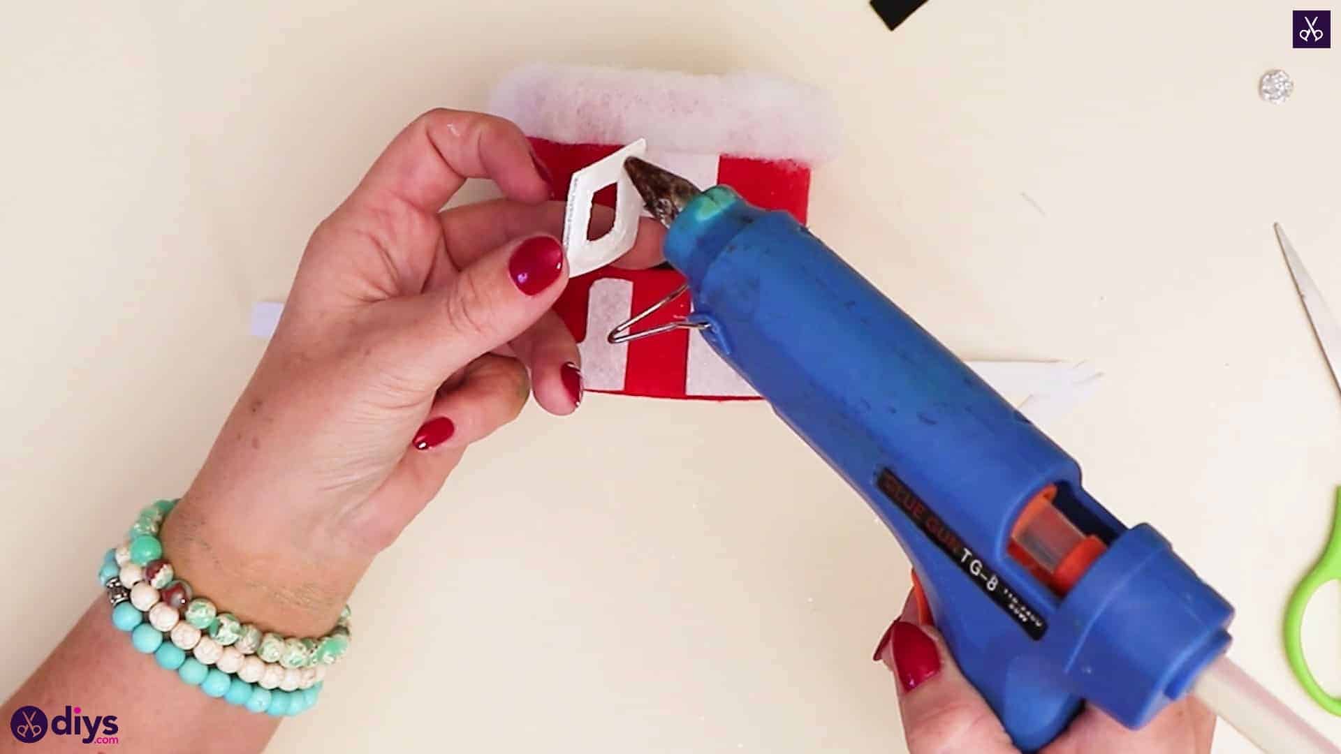 Tin can santa candy holder glue process