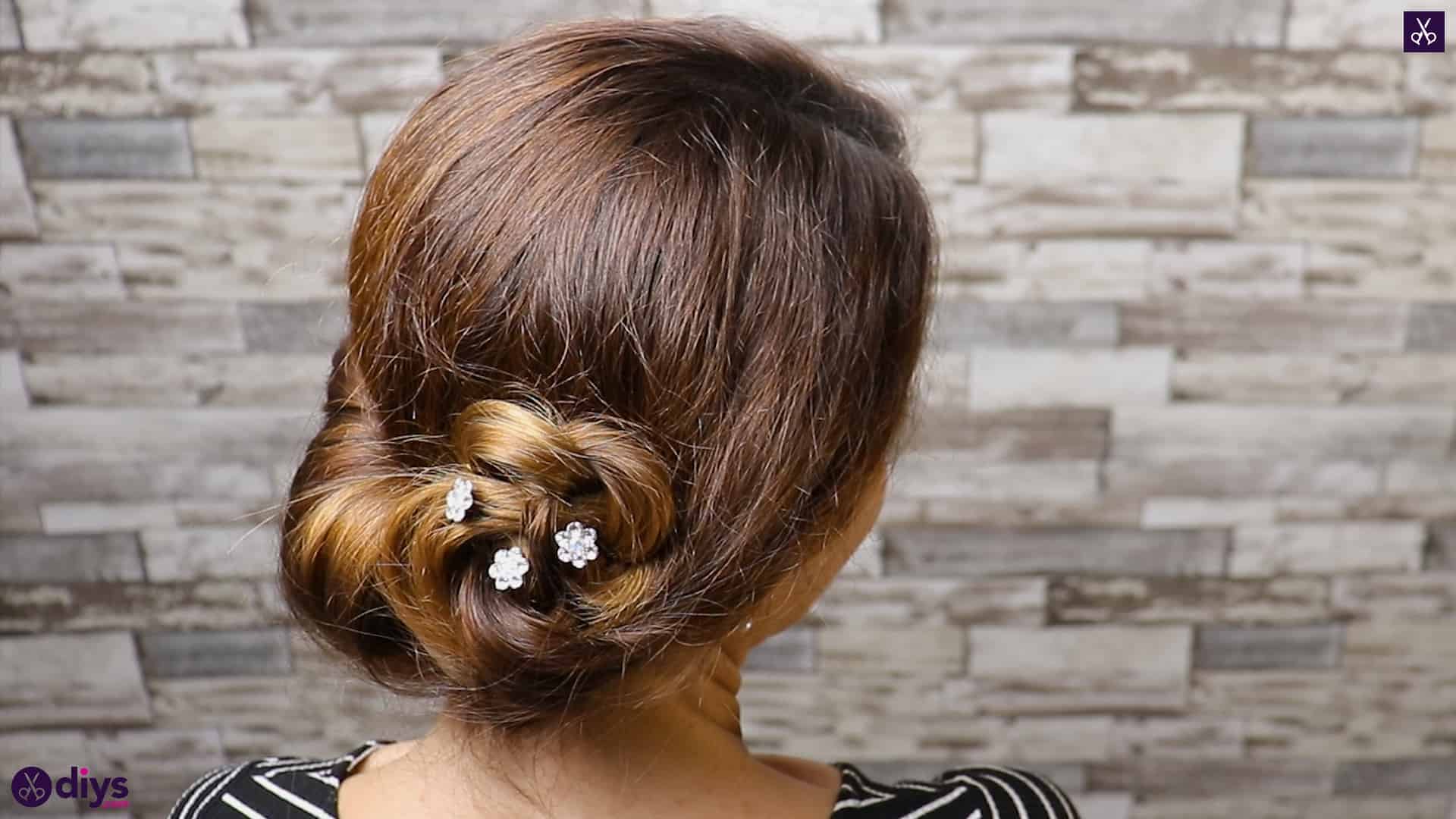 Beautiful summer bun with flowers hairstyle step 5d