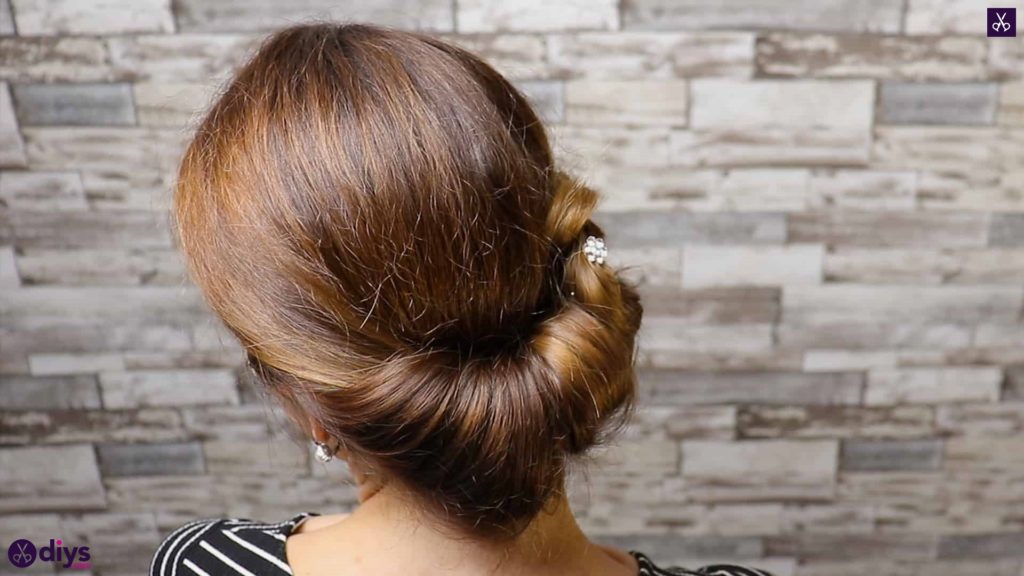 Beautiful summer bun with flowers hairstyle step 5e