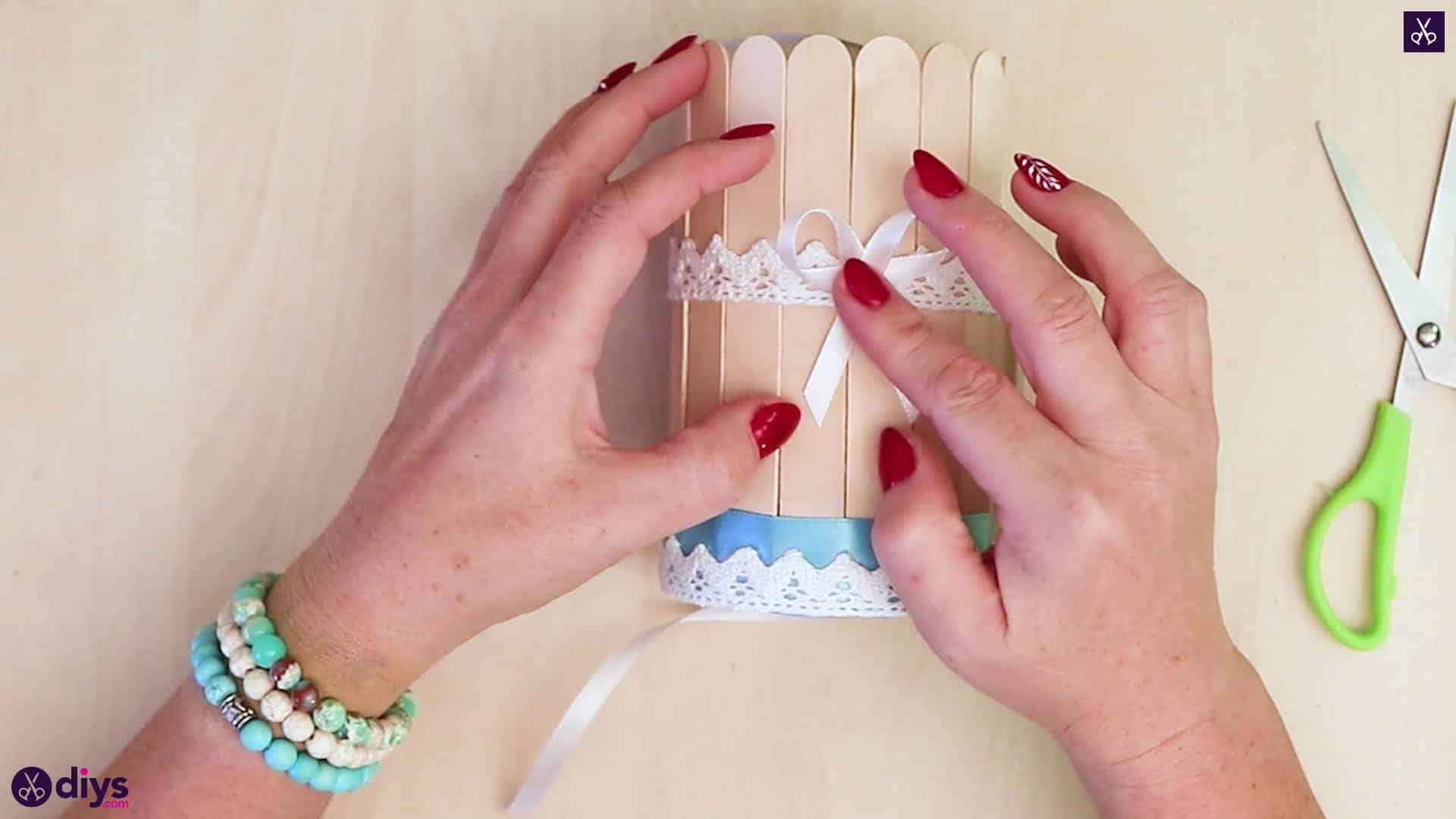Elegant popsicle stick covered tin container bow