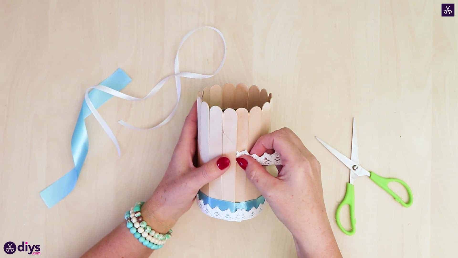 Elegant popsicle stick covered tin container half ribbon