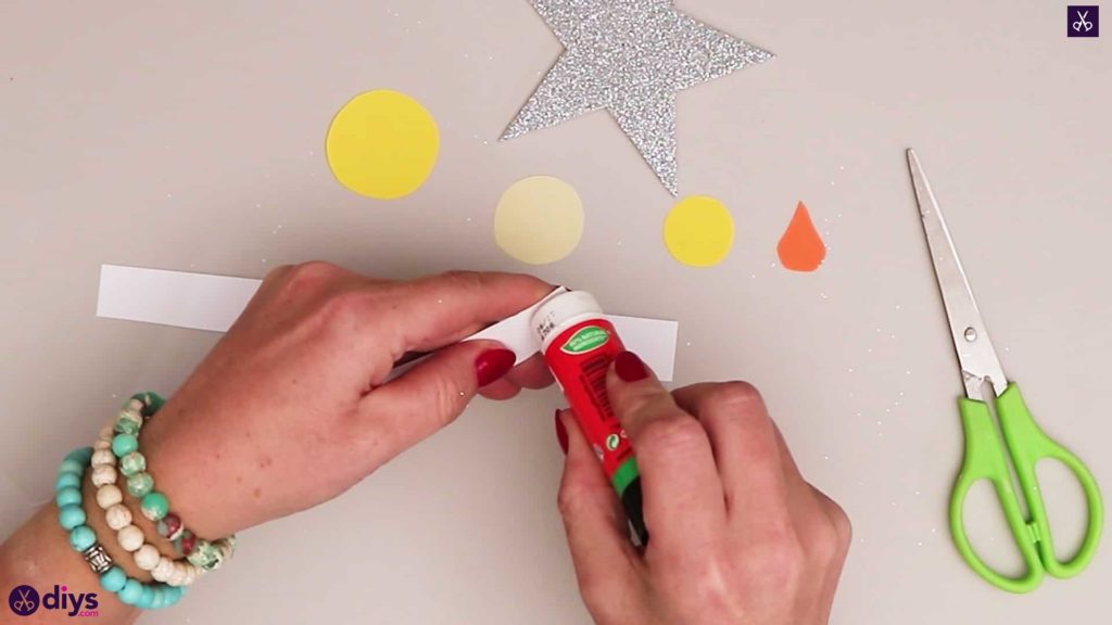Paper candle on a star adhesive