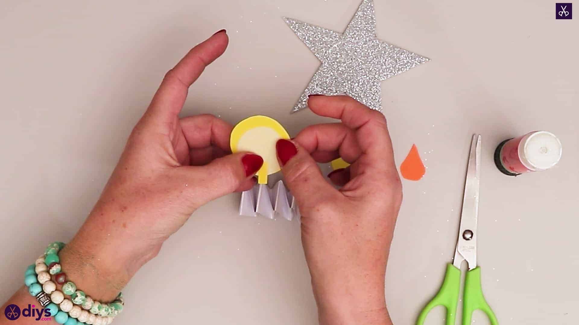 Paper candle on a star press