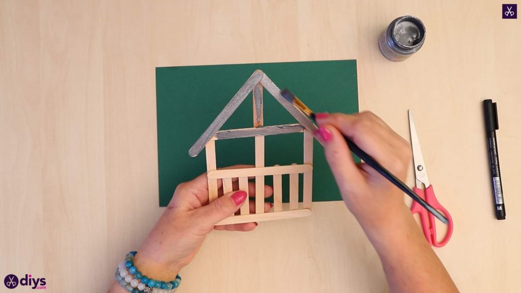 Popsicle stick house ornament start painting process