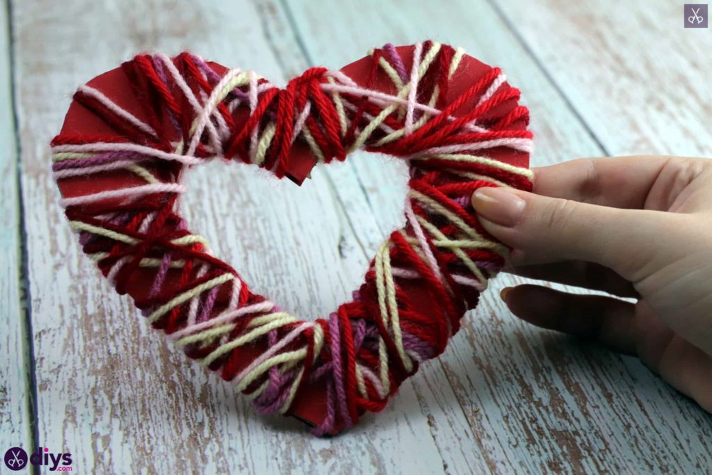 Diy yarn wrapped paper heart display