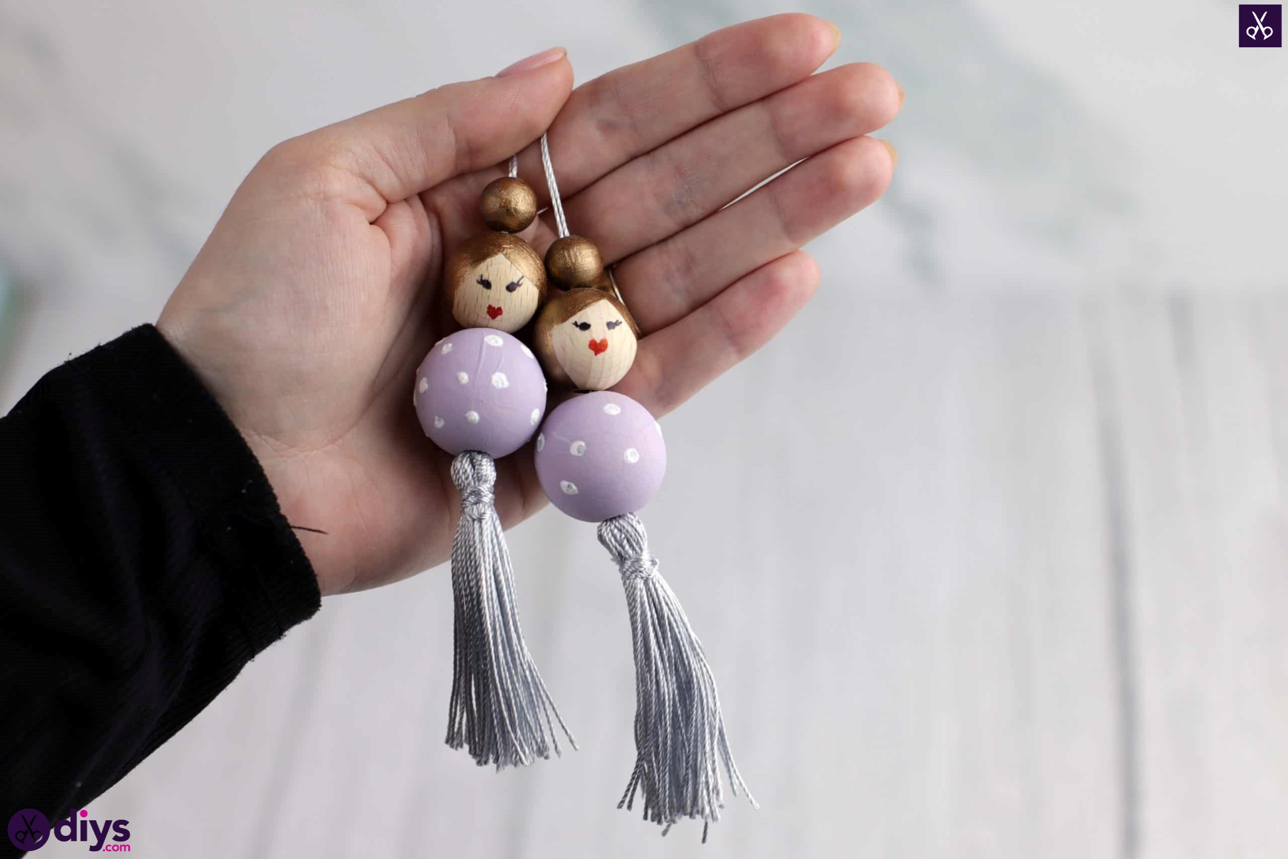 Wooden pearl doll display