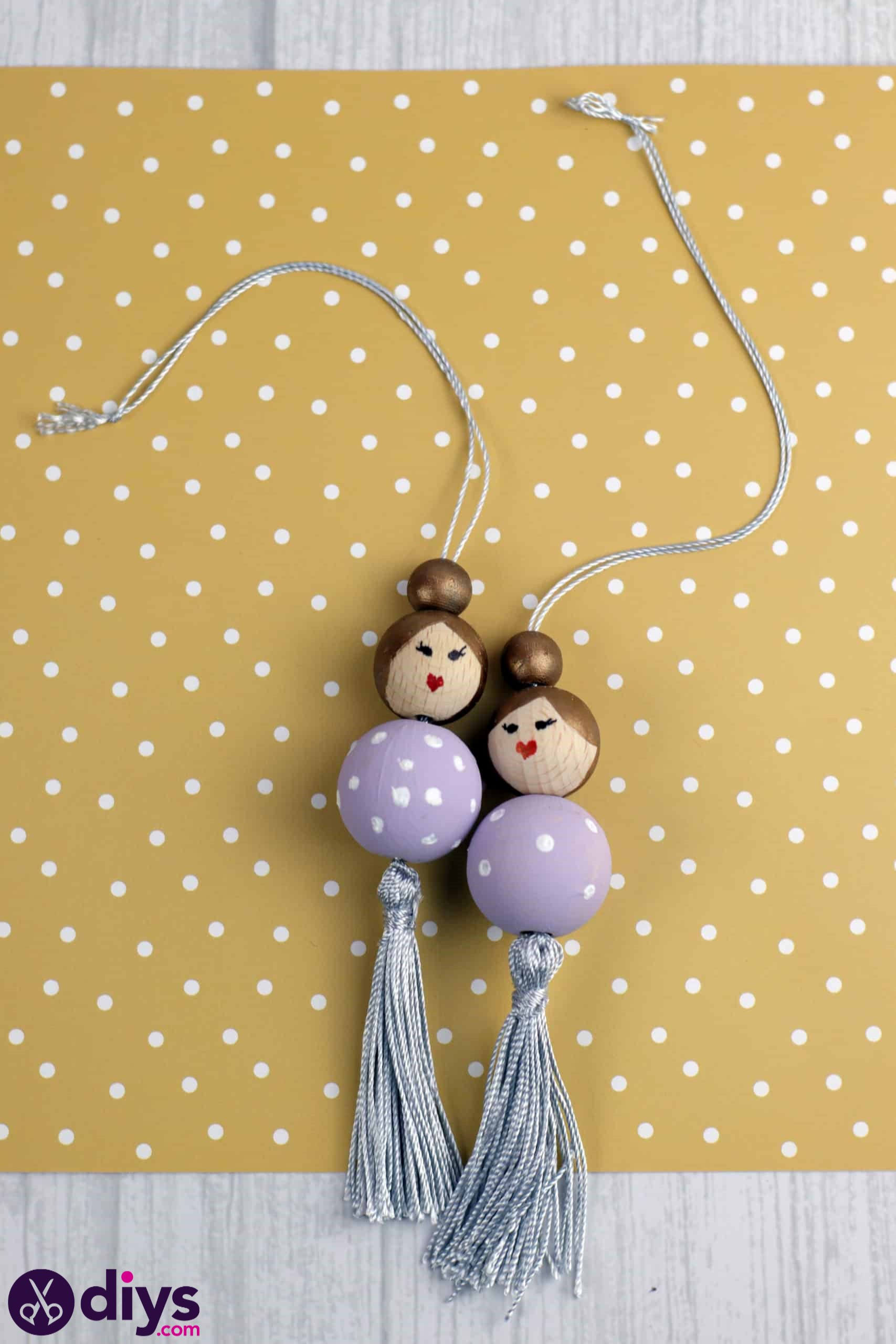 Wooden pearl doll hanging
