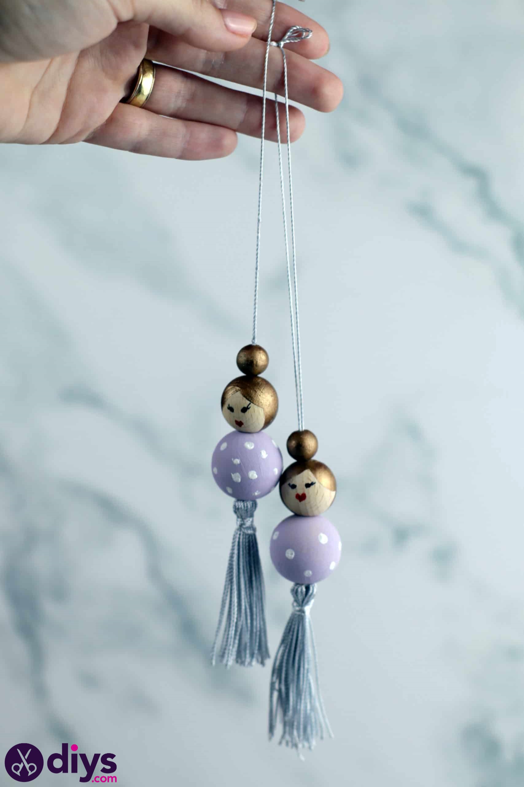 Wooden pearl doll string