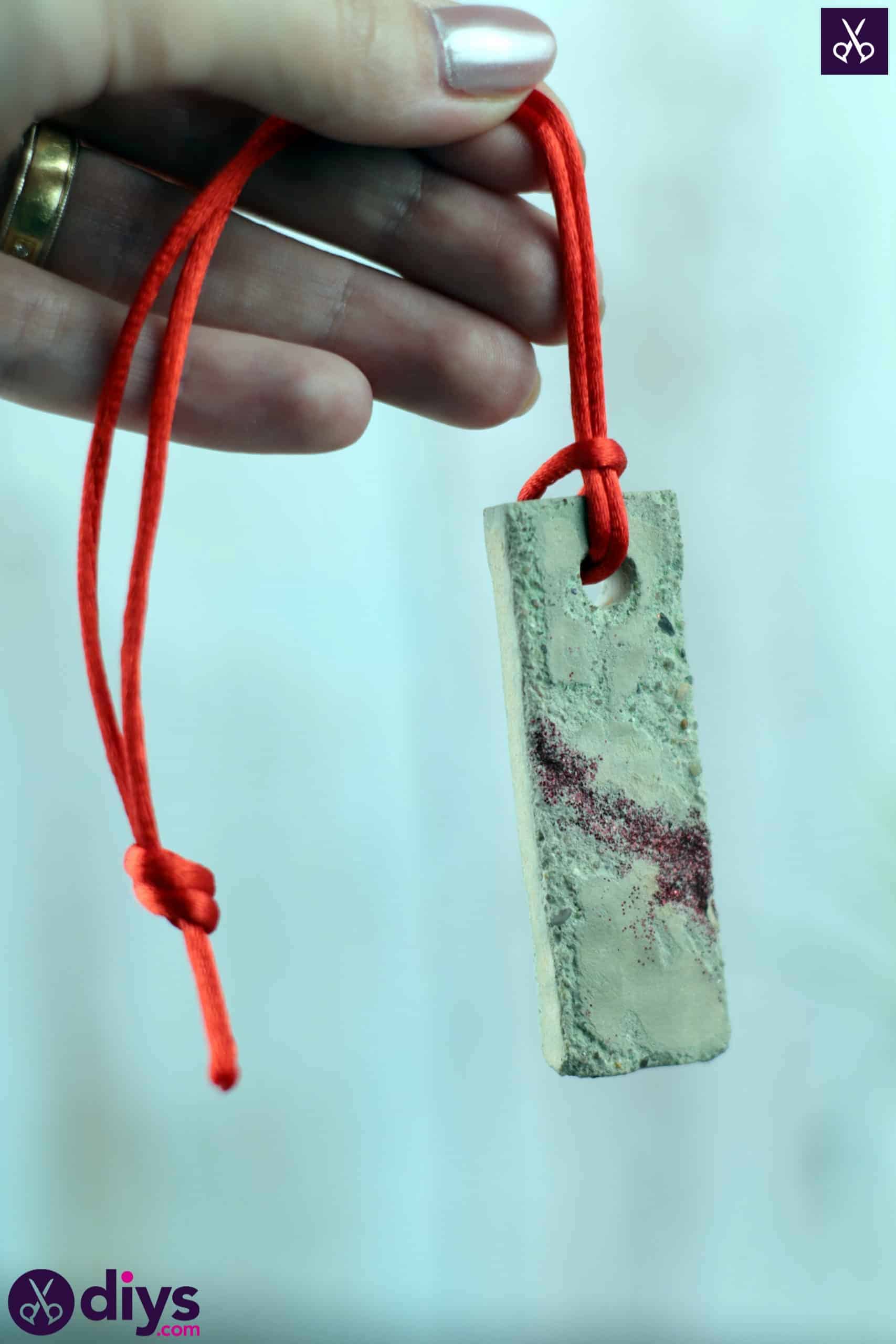 Diy concrete necklace with glitter red string