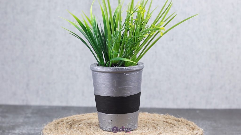 Tall concrete flower pot