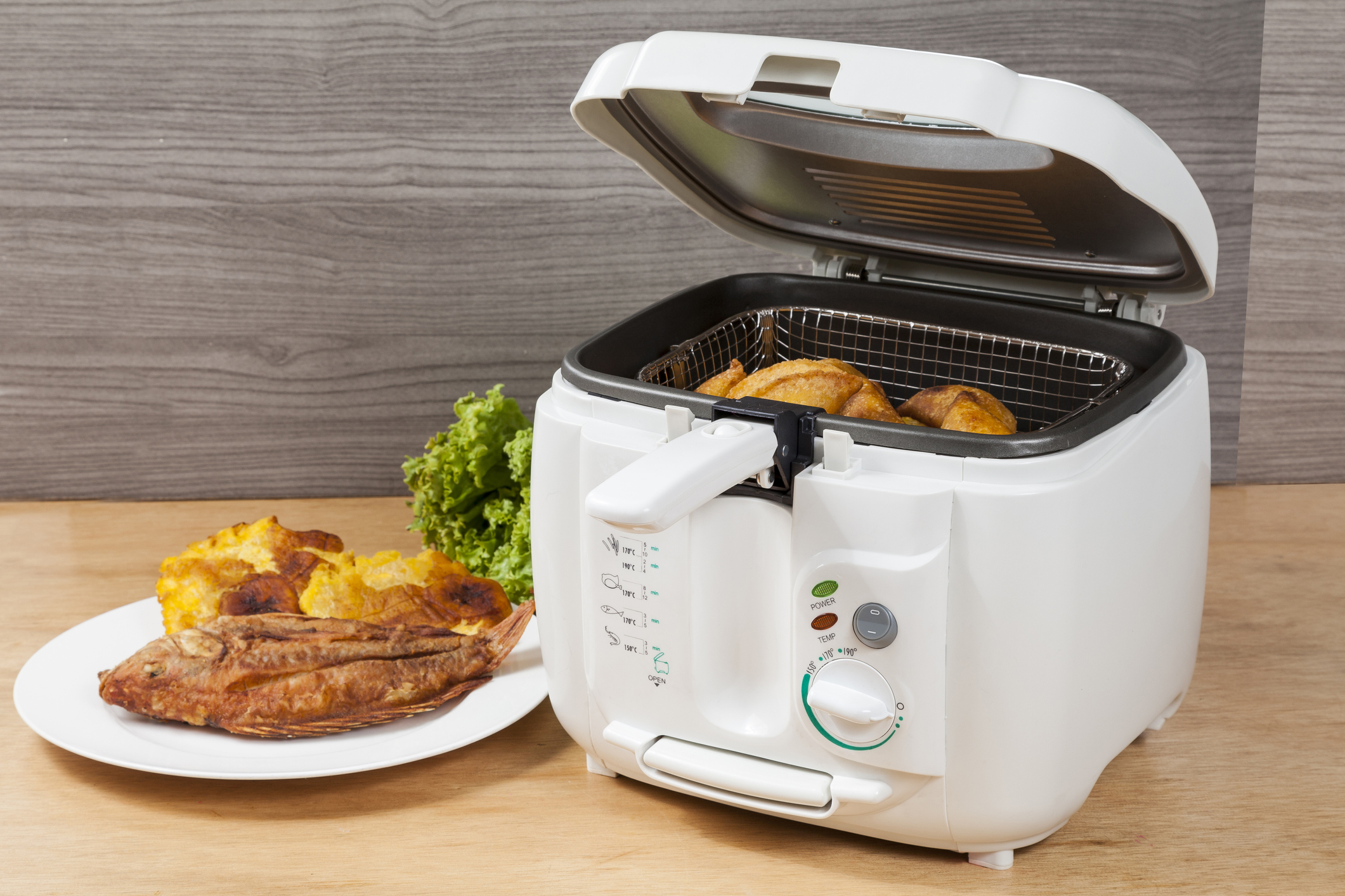 Household kitchen a white automatic electric fryer pot