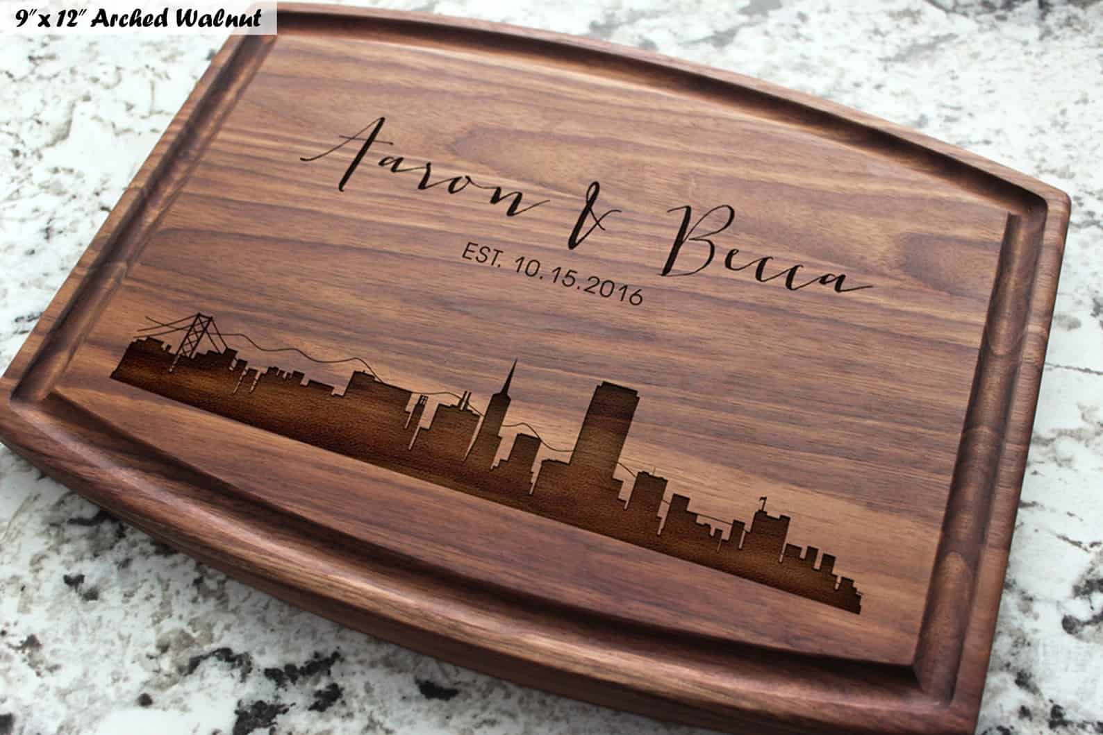Personalized cutting board with engraved city skyline