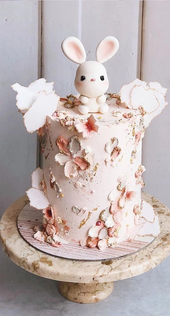 White and pink rabbit baby shower cake