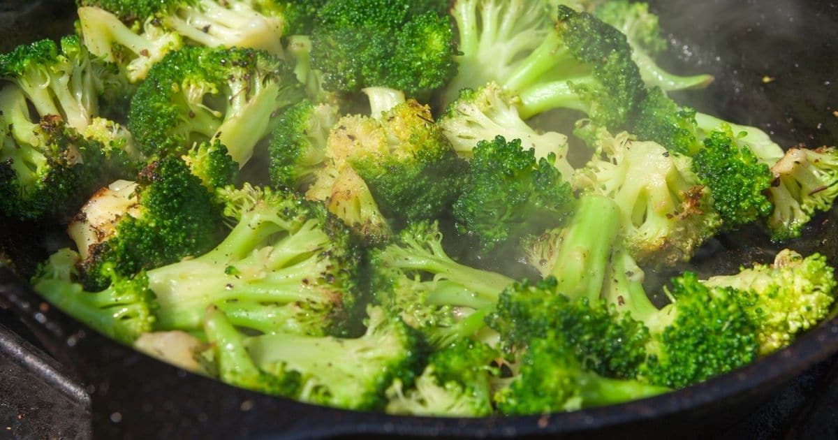 Sauteed broccoli in a pan.