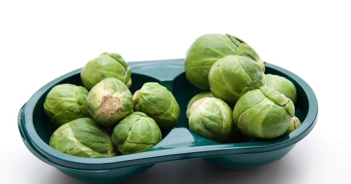 Brussel sprouts in a plastic bowl.