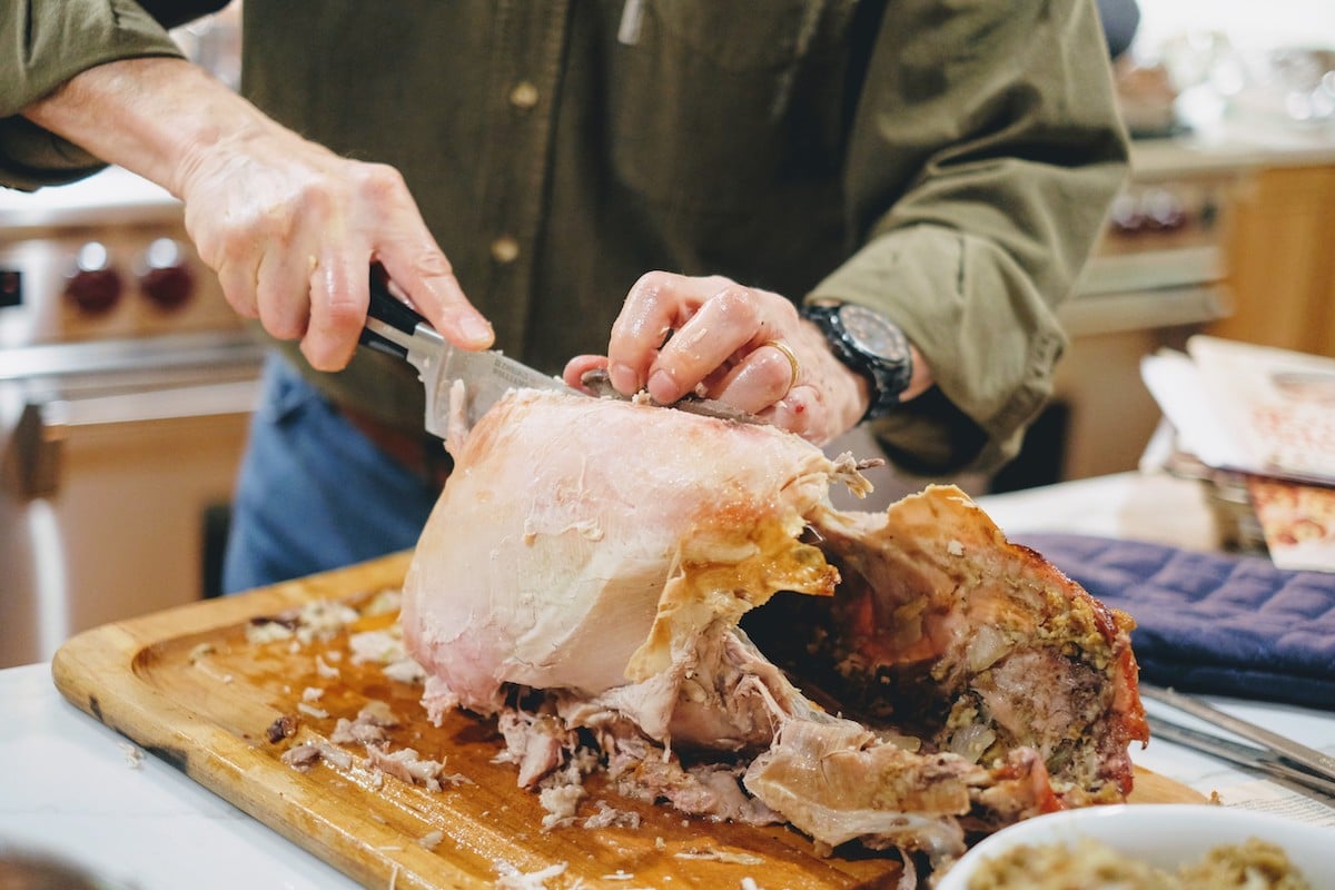A man carving the turkey