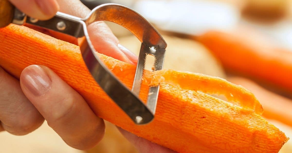 A carrot being peeled