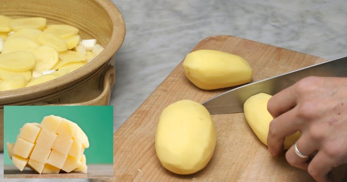 Peeled potatoes being cut on top a wooden chopping board