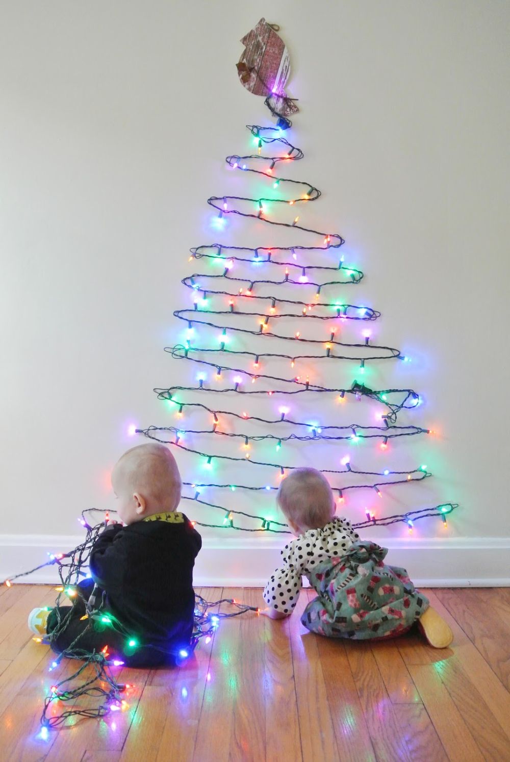 Diy wall mounted christmas tree using string lights