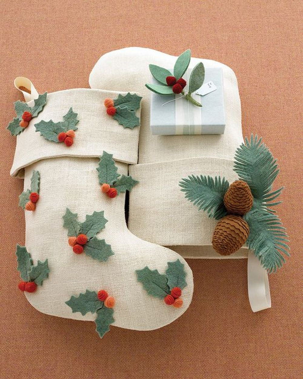 Baby christmas stockings with holly leaves 
