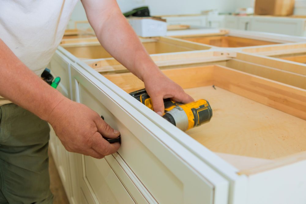 Reinstalling hardware painting kitchen cabinets