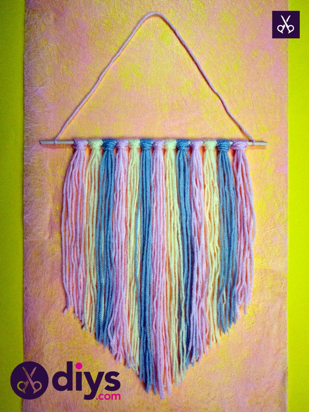 Diy colorful yarn wall hanging